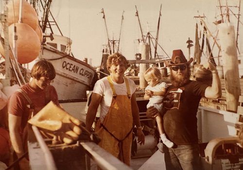 Captain Michael Black with his crew on deck